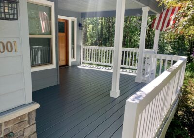 Front porch deck refinished with solid color deck stain after professional surface preparation in La Center WA.